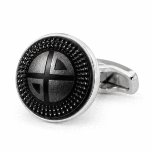 Close-up view of luxury black and silver textured round cufflinks for men.