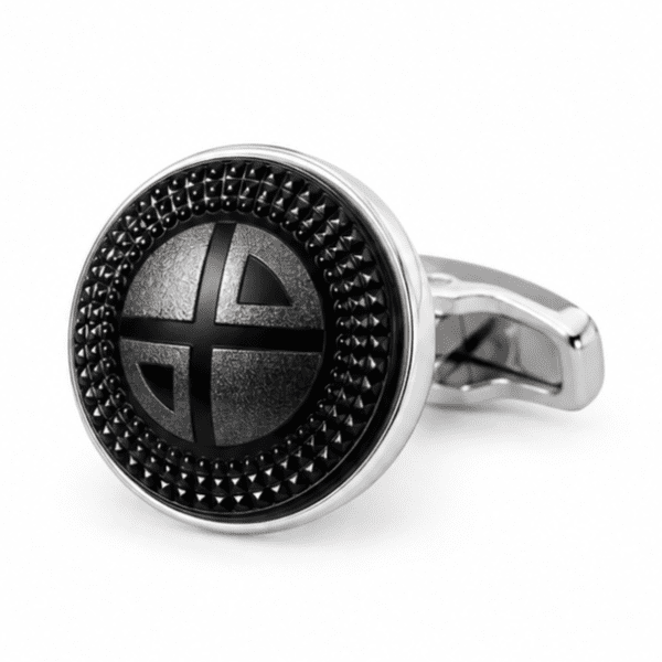 Close-up view of luxury black and silver textured round cufflinks for men.