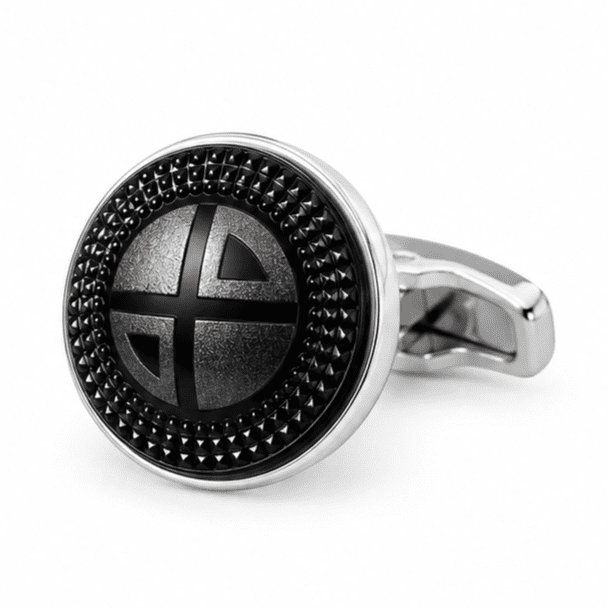 Close-up view of luxury black and silver textured round cufflinks for men.