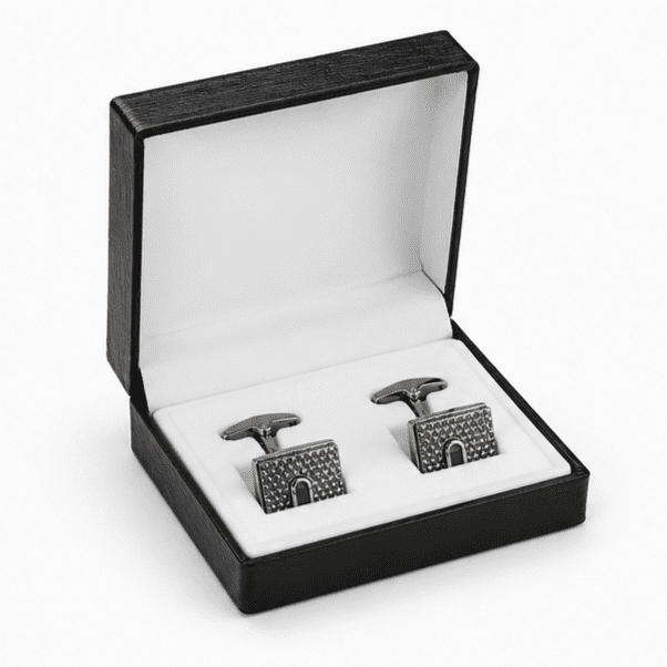 Luxury silver cufflinks displayed in premium gift box