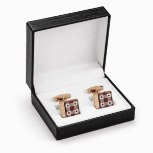 Luxury burgundy and gold designer cufflinks presented in a premium gift box.