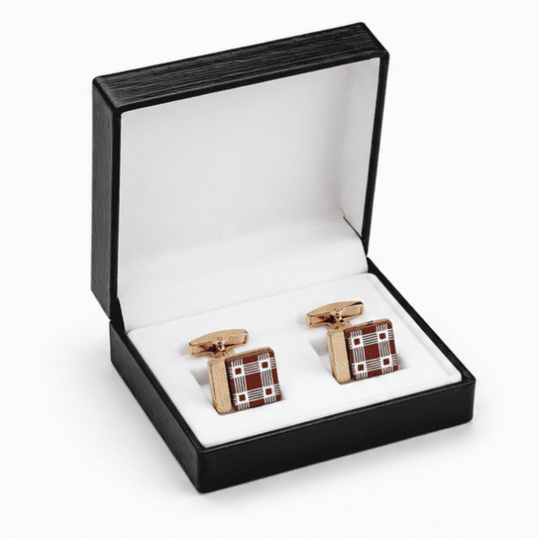 Luxury burgundy and gold designer cufflinks presented in a premium gift box.