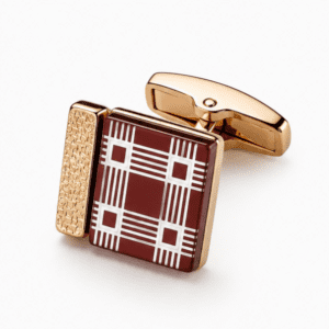 Close-up view of luxury burgundy and gold plaid square cufflinks for men.