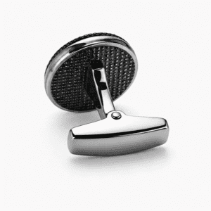 Side view of silver round cufflinks showing toggle bar clasp and textured black back plate