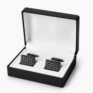 Black luxury cufflinks displayed in premium gift box