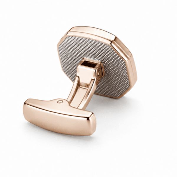 Side view of rose gold cufflinks showing toggle clasp and textured back plate