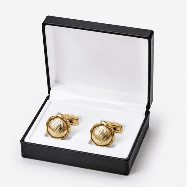 Luxury gold cufflinks displayed in premium gift box