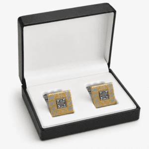 Luxury gold and silver cufflinks displayed in premium gift box for men