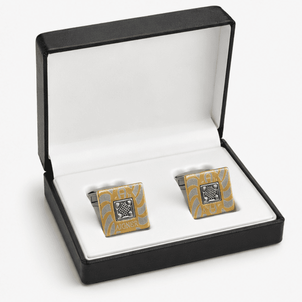 Luxury gold and silver cufflinks displayed in premium gift box for men