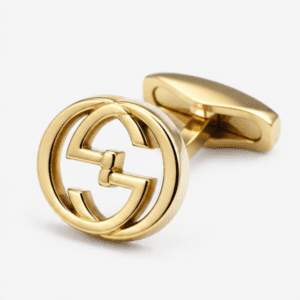 Close up view of round gold interlocking designer cufflink pattern