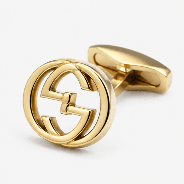 Close up view of round gold interlocking designer cufflink pattern