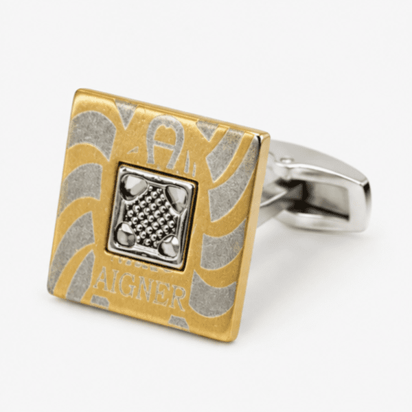 Close up view of square gold and silver designer cufflinks with detailed center design