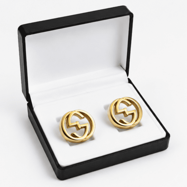 Gold interlocking round cufflinks for men displayed in premium box