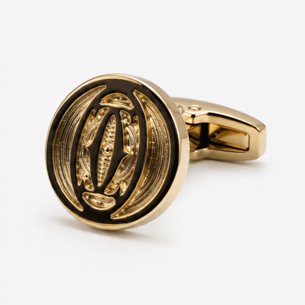 Close up view of two tone antique gold cufflinks with embossed design