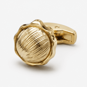 Close up view of round gold designer cufflinks for men