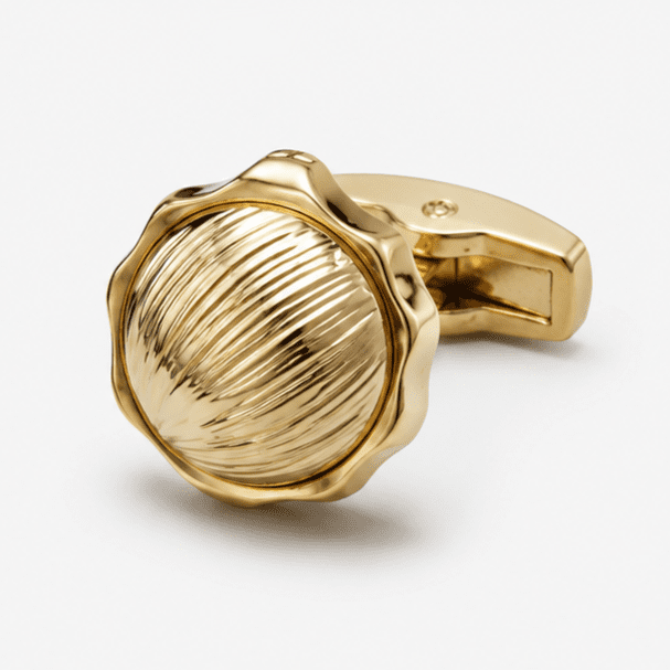 Close up view of round gold designer cufflinks for men