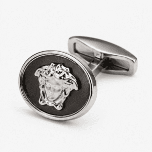 Close up view of silver Medusa designer cufflinks