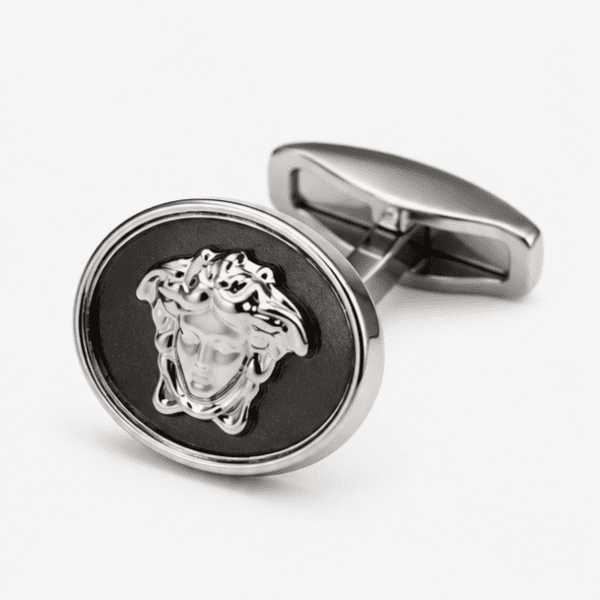 Close up view of silver Medusa designer cufflinks