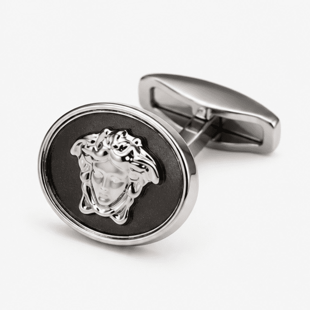 Close up view of silver Medusa designer cufflinks