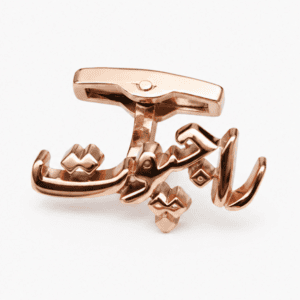 Angled view of premium Rajput rose gold cufflinks with Urdu lettering